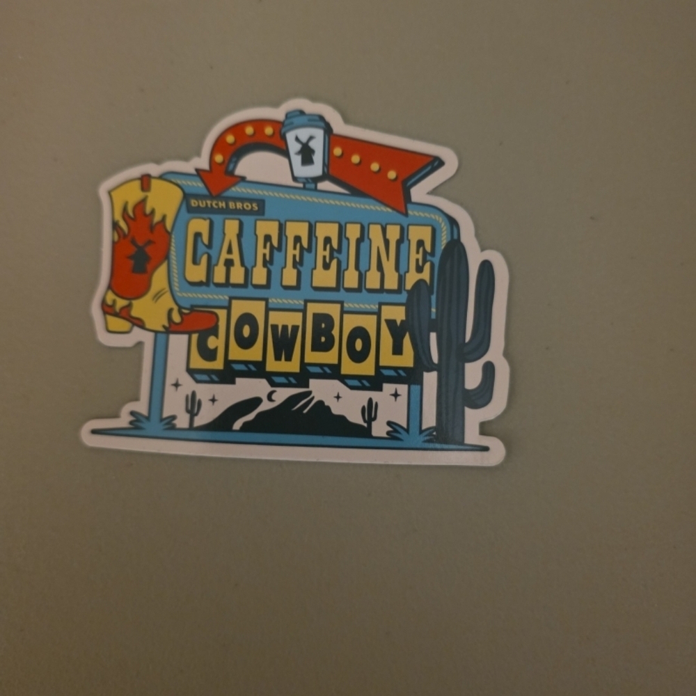 Dutch Bros Caffeine Cowboy Sticker - Blue, Yellow, Red, Black